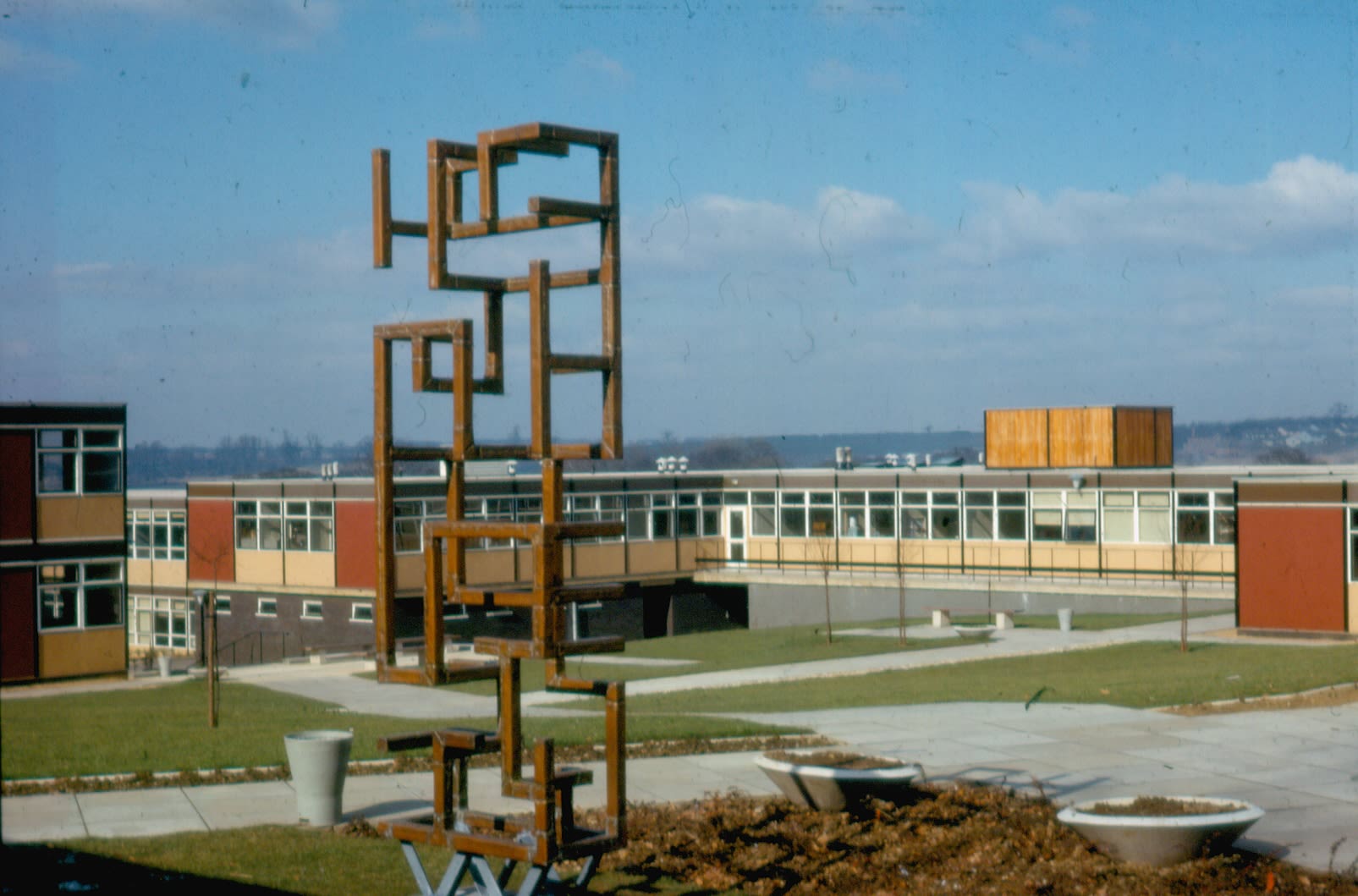 a wide shot of a series of buildings from the 1960s