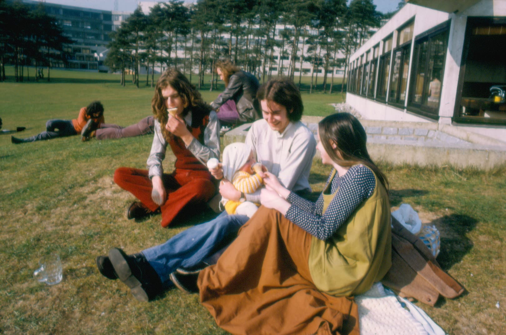 Students from the 1970s socialising in the sun outside the Ziggurats.