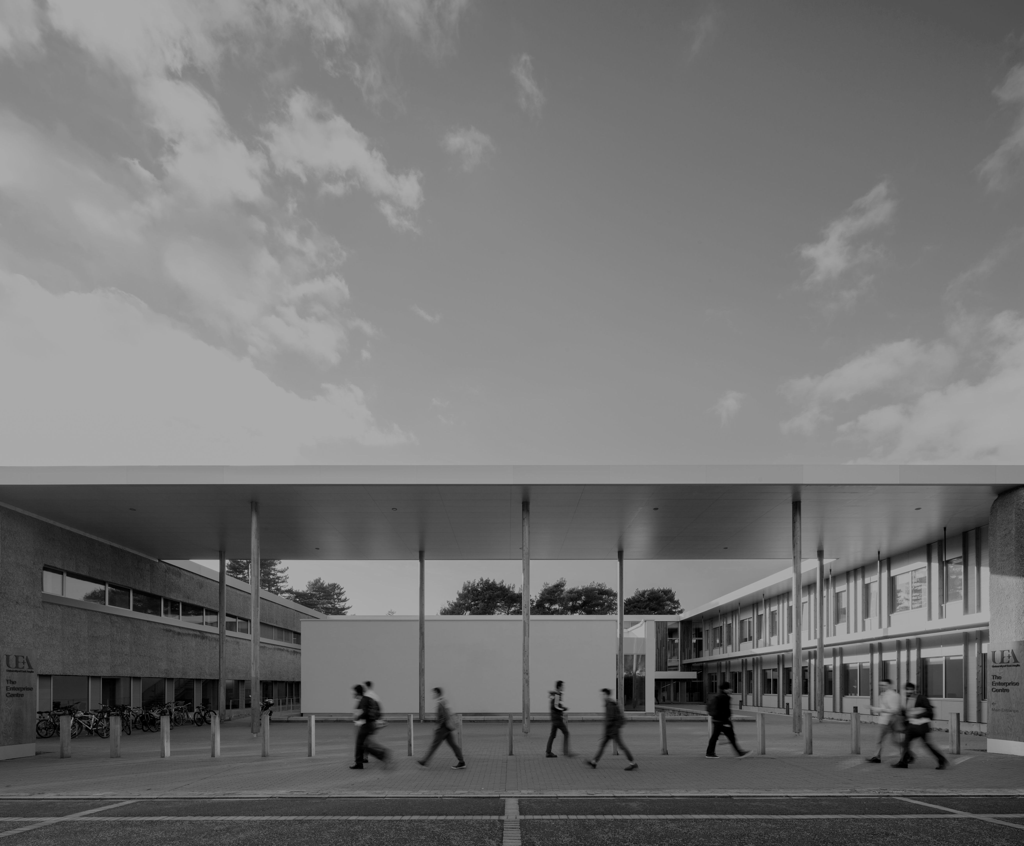 Blurred people walk through a modern building