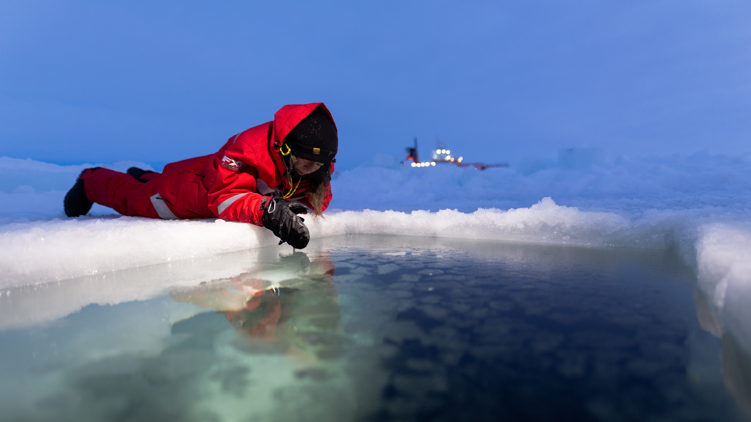 A scientist sampling freezing seawater