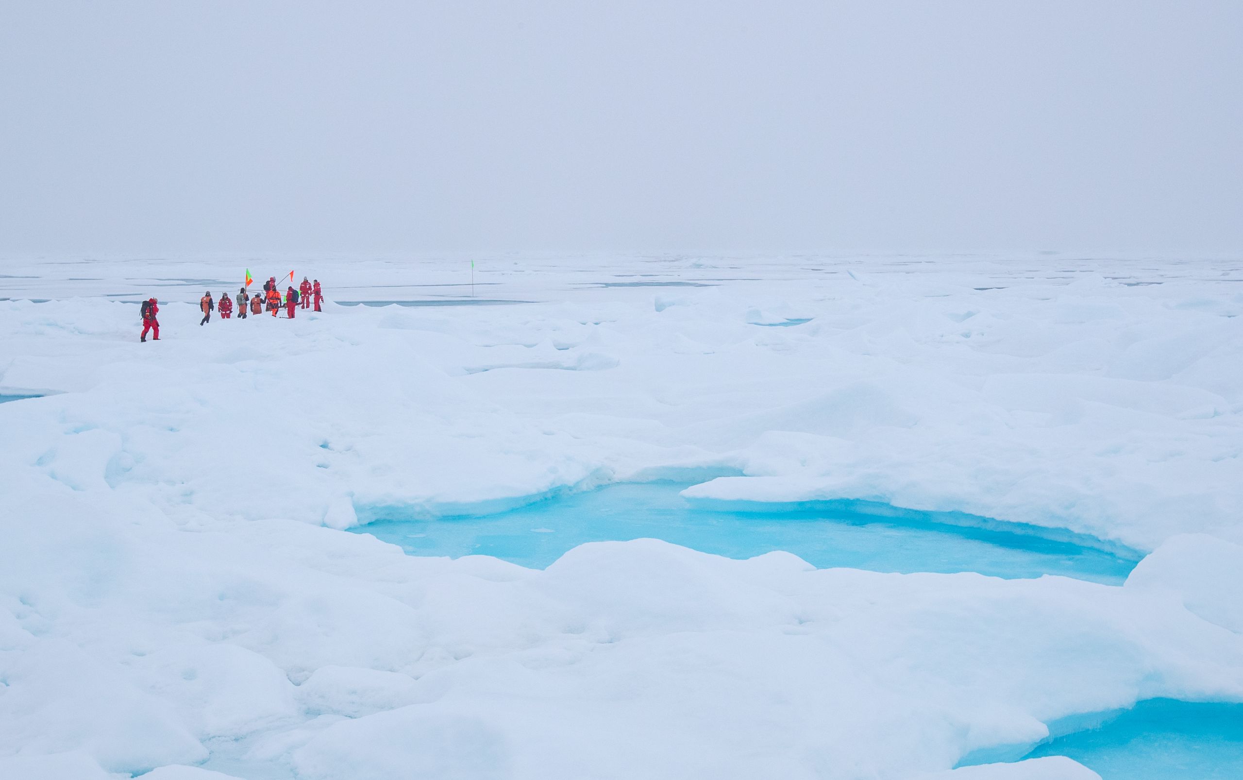 Scientists in survival suits in the Arctic
