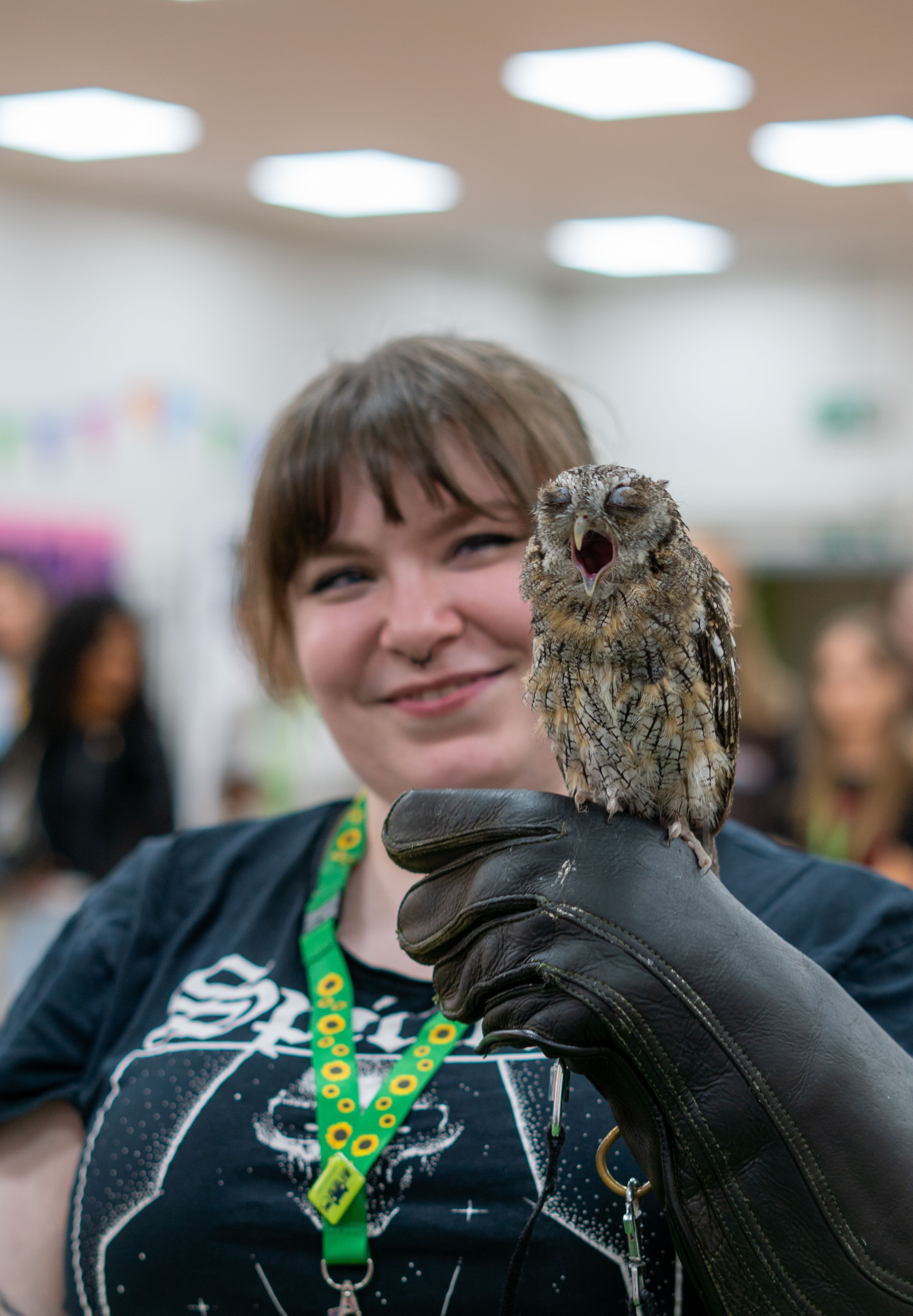 Student holding an owl on her glove