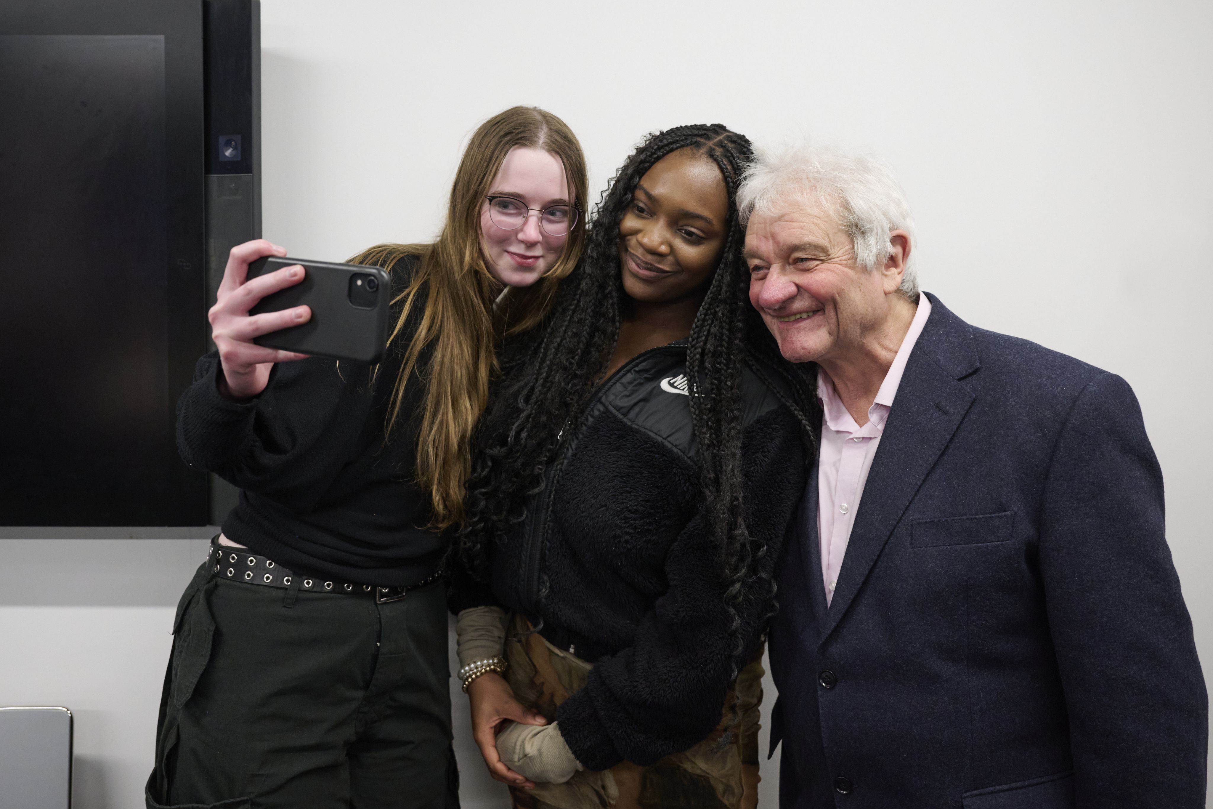 Paul Nurse getting a selfie with two students