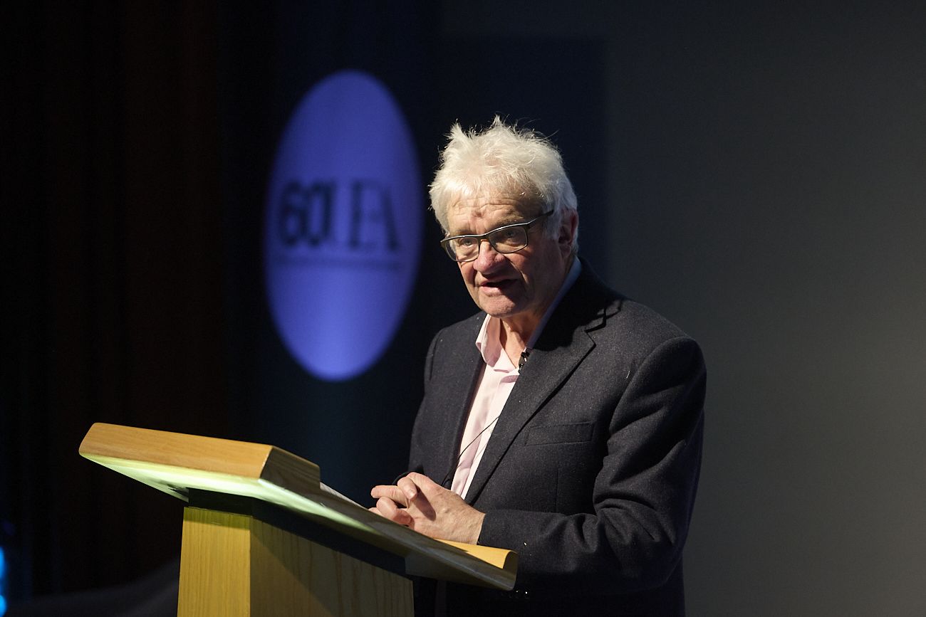 Sir Paul Nurse at a lecturn at the UEA 60th anniversary lecture
