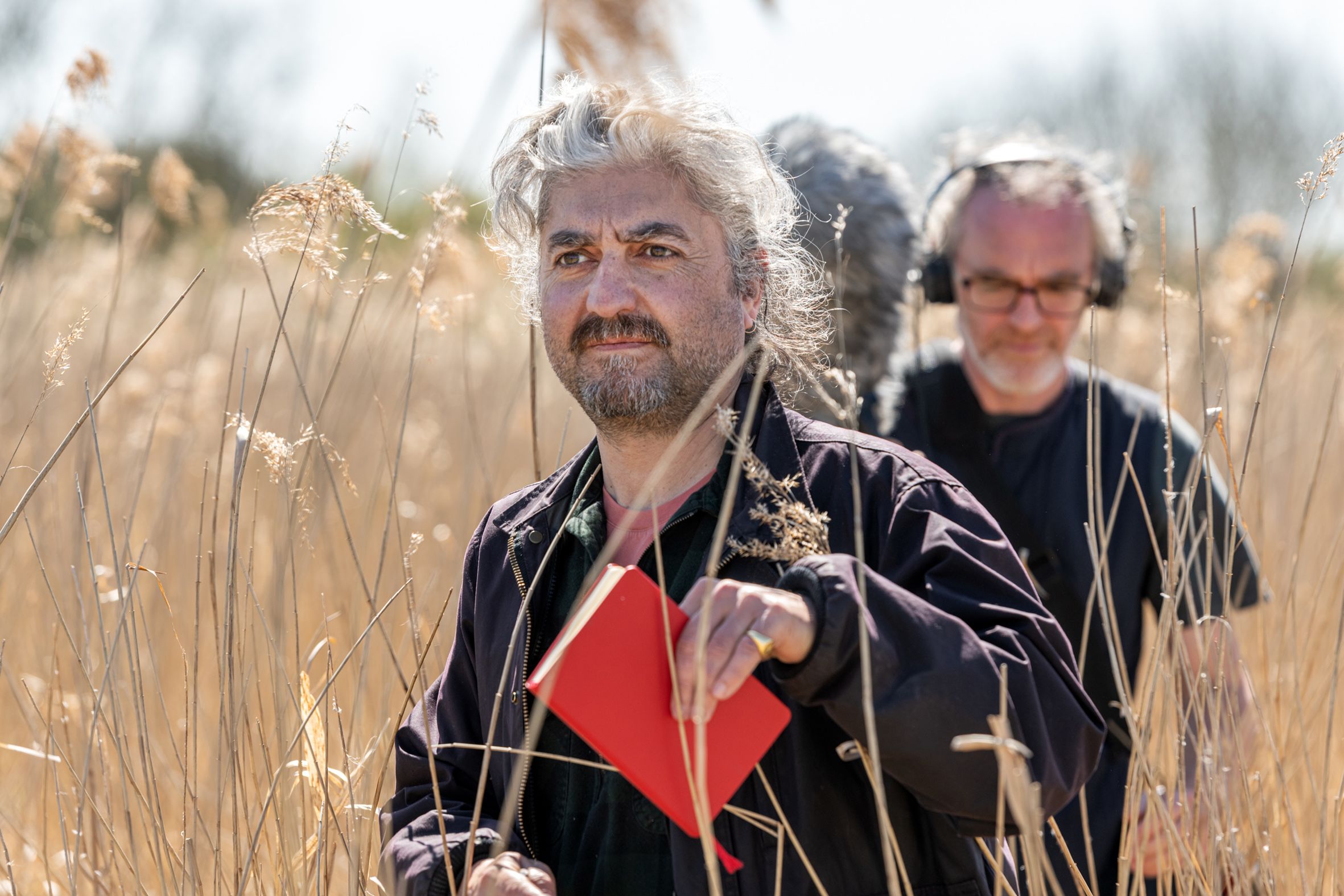 Radio recording crew members on set at strumpshaw fen in norwich
